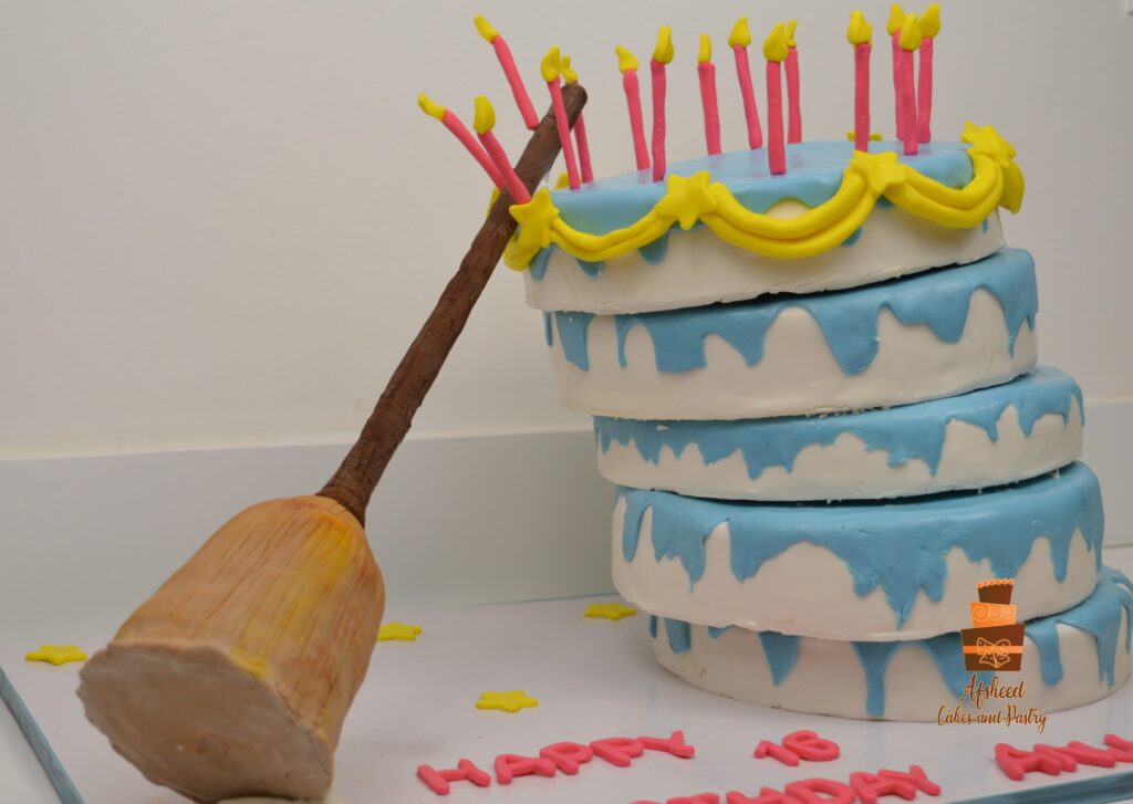 Princess-themed birthday cake featuring playful broom design and colorful layers, made by Afsheed Custom Cakes Calgary