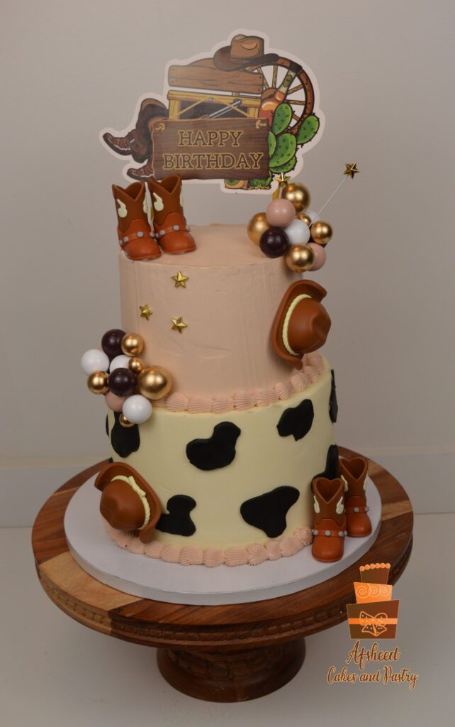 Cowboy-themed custom birthday cake for boys with locally sourced decorations supplied by mom in Calgary