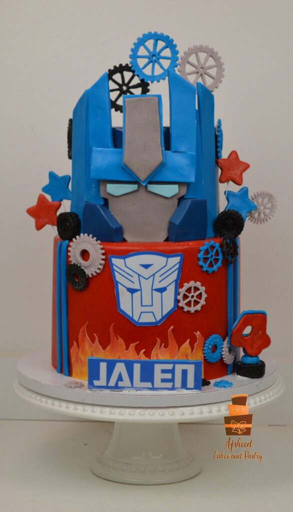 Calgary custom Transformers birthday cake for boys featuring handmade robot decorations and metallic finishes