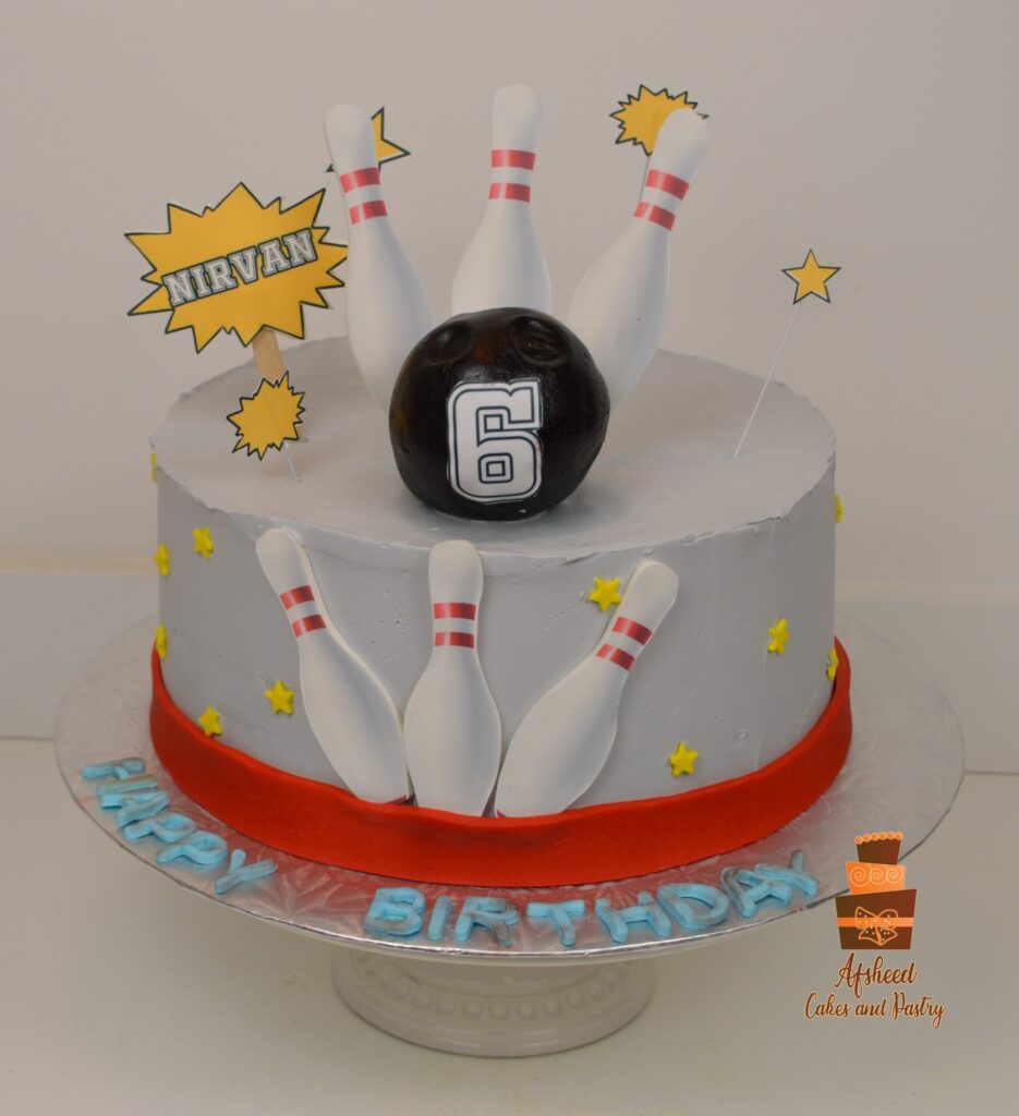 Bowling-themed kids birthday cake with edible pins and fondant bowling ball handmade in Calgary by Afsheed Cakes