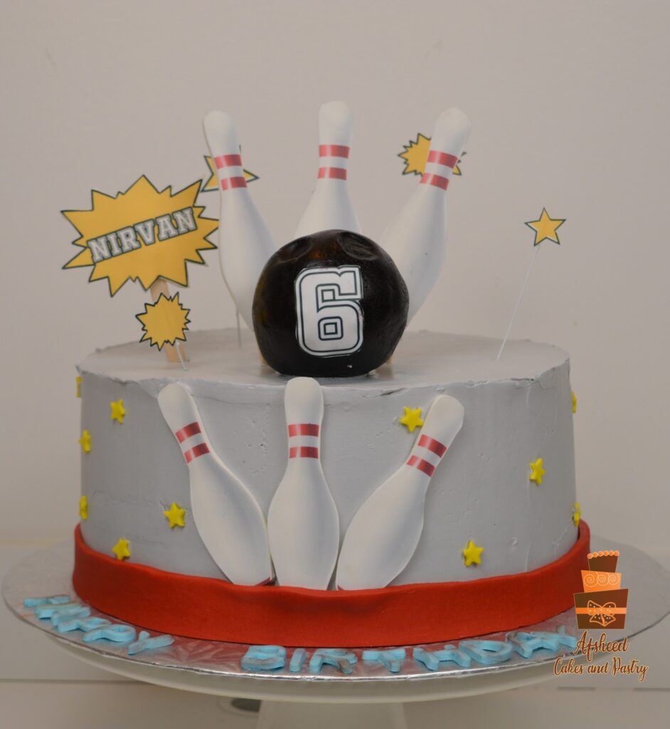 Custom bowling birthday cake for children featuring edible decorations and vibrant fondant details in Calgary