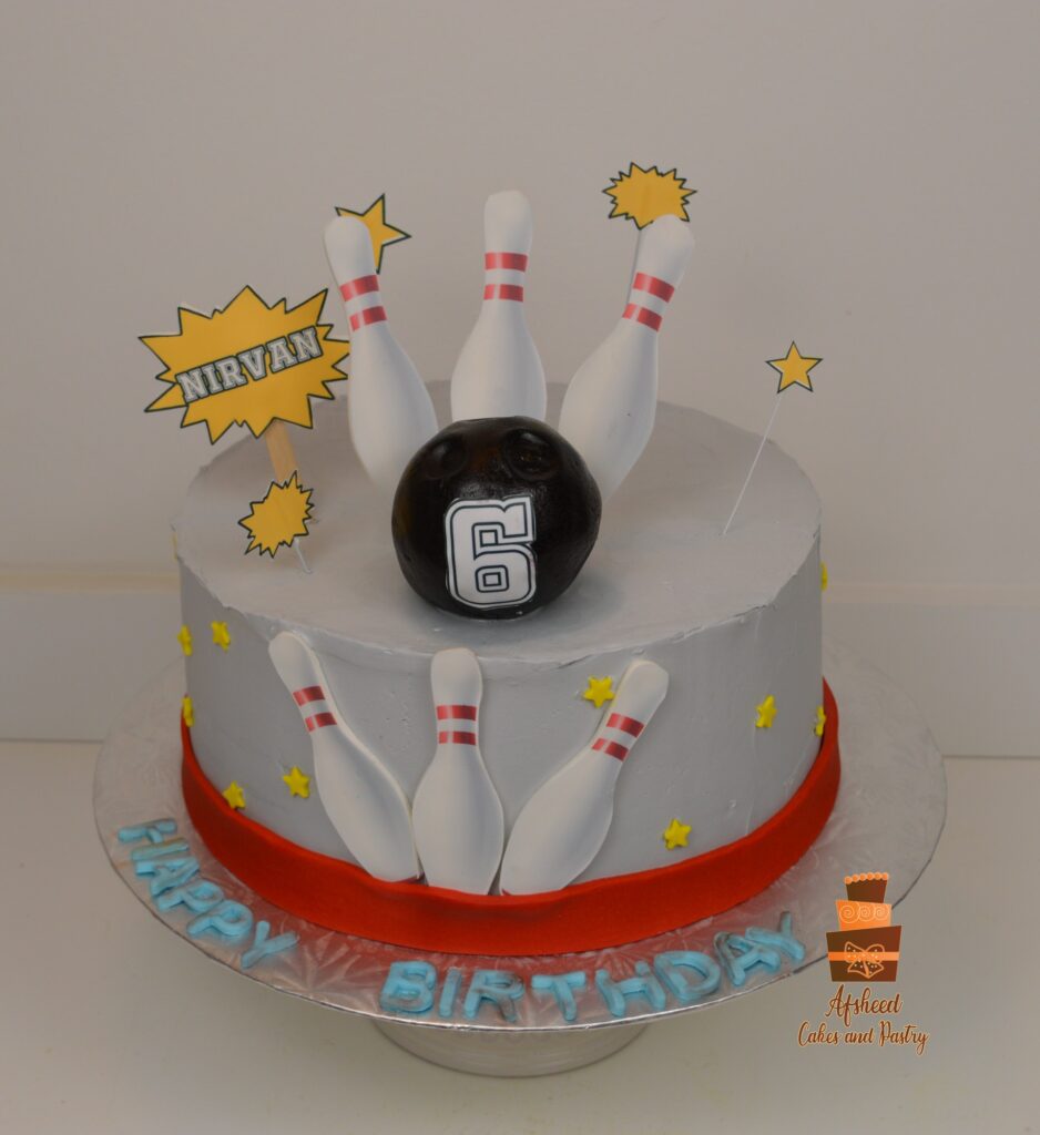 Calgary custom kids birthday cake with bowling alley design, edible pins, and fondant bowling ball by Afsheed Cakes & Pastry