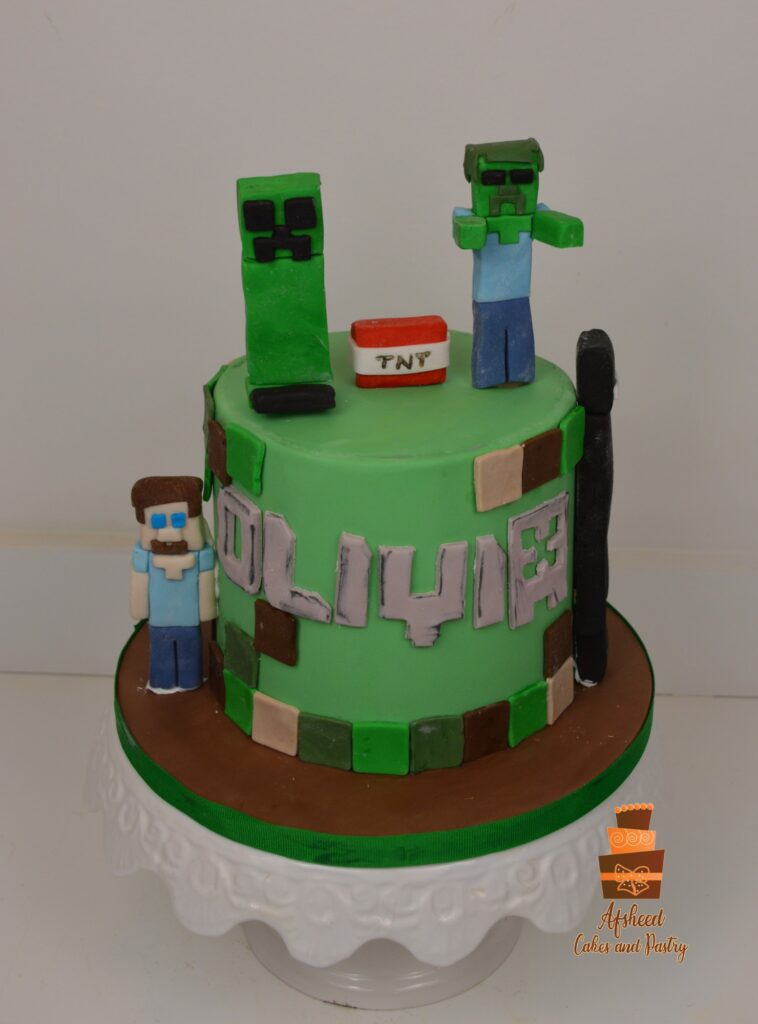 Boy’s Minecraft-themed birthday cake with detailed edible figures by Afsheed Cakes Calgary.