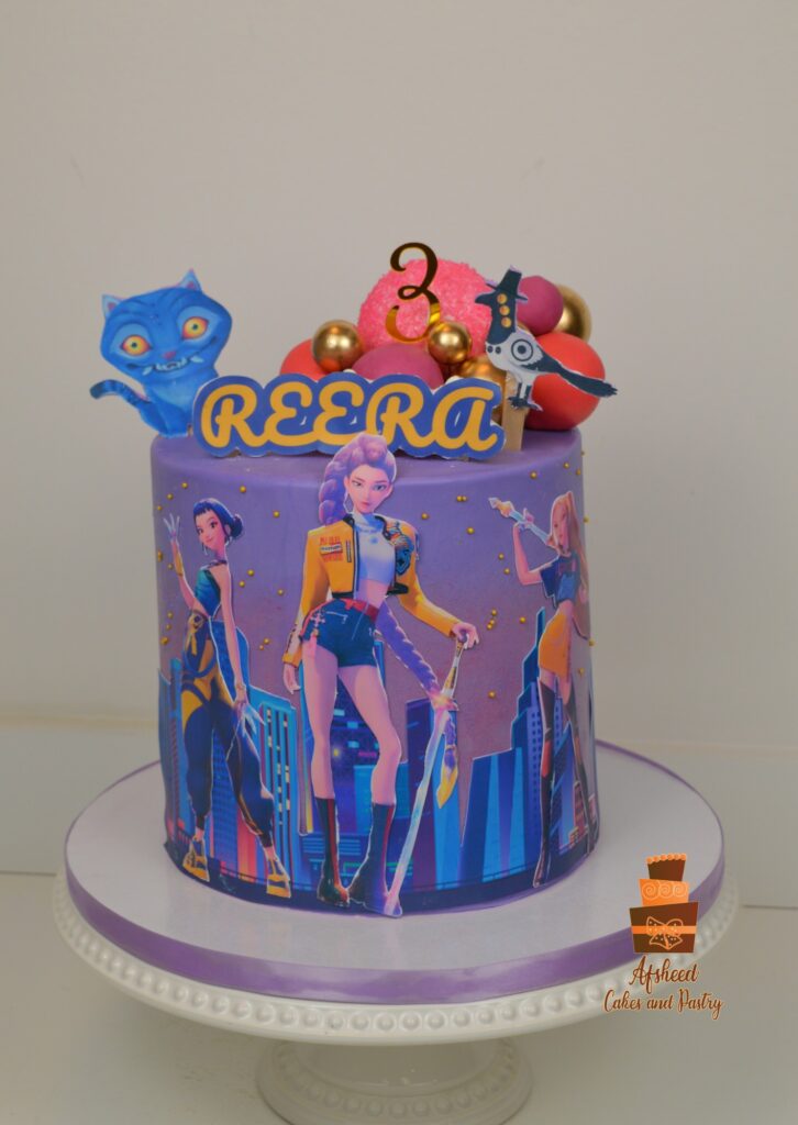 Custom K-Pop Demon Hunters cake for girls featuring Huntrix band design and bright edible decorations by Afsheed Cakes Calgary.