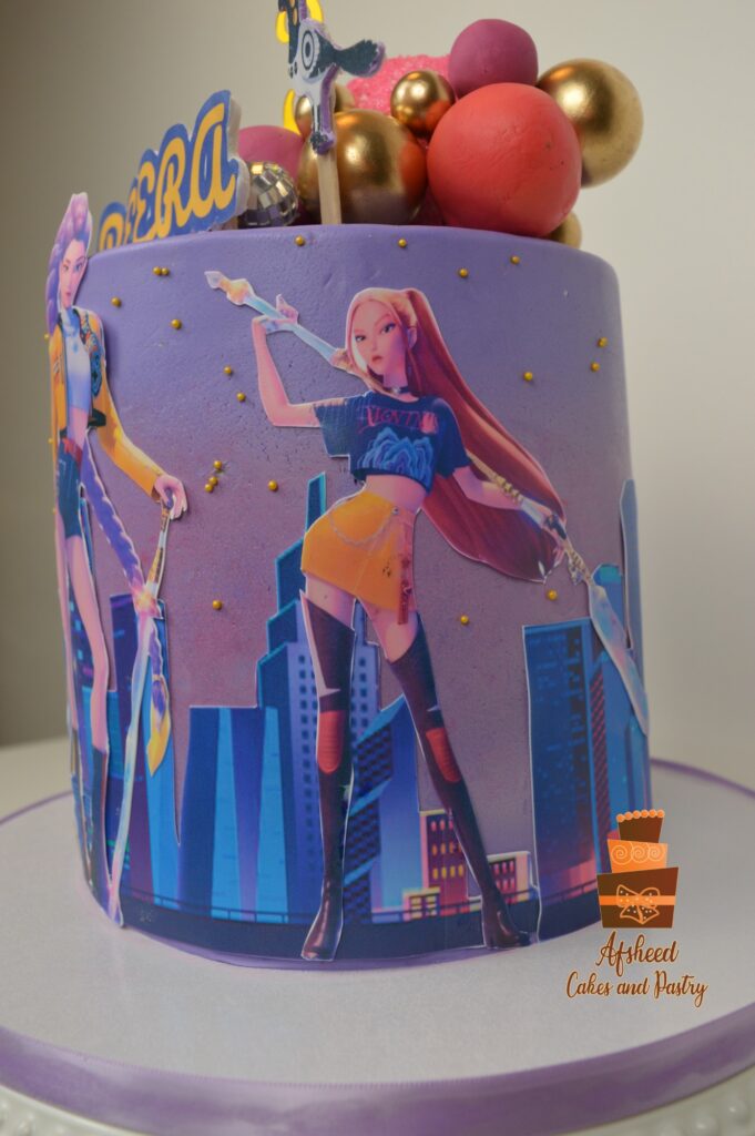Handcrafted K-Pop Demon Hunters Huntrix birthday cake for girls designed by Afsheed Cakes & Pastry in Calgary.